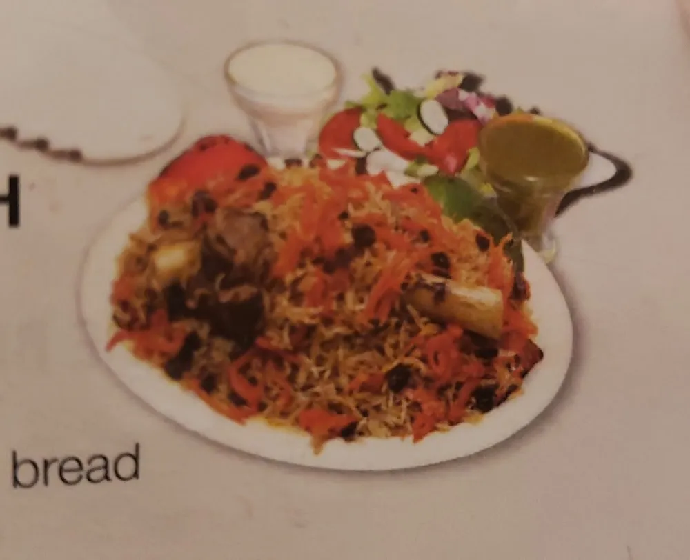 13 Lamb Shank with Qabeli Palaw